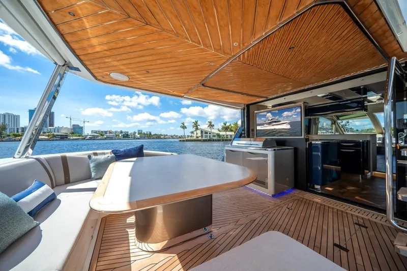 Slide: The Image of Luxurious 2026 Galeon 640 Fly yacht interior with elegant seating and waterfront view. - 9