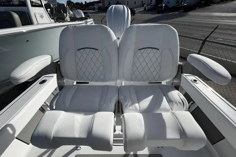 Slide: The Image of 2026 Sportsman Masters 247 Bay Boat with luxurious white seating and armrests. - 16