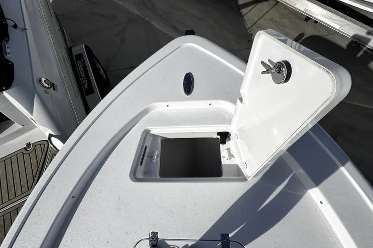 Slide: The Image of 2026 Sportsman Masters 247 Bay Boat open storage compartment on deck. - 6