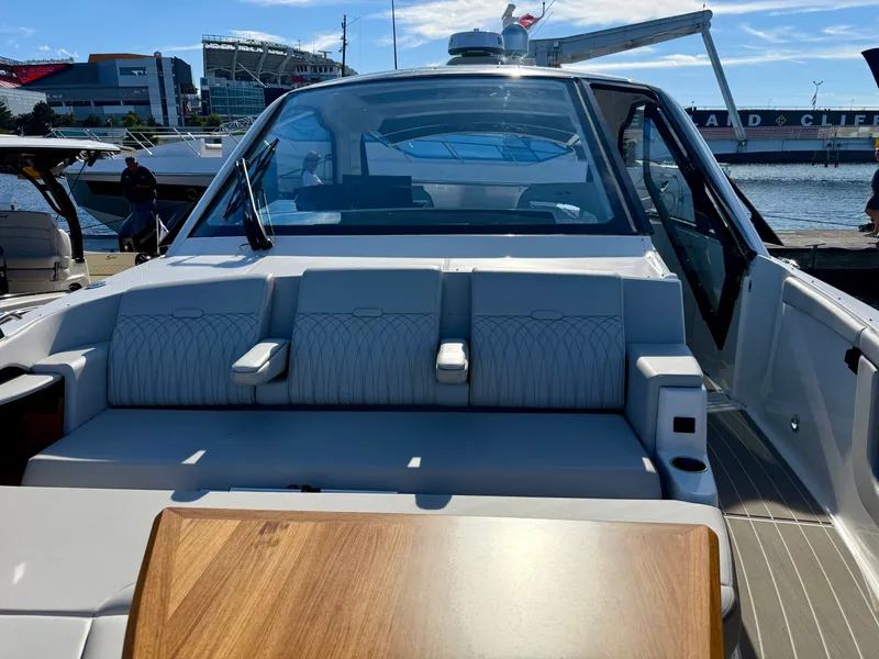 Slide: The Image of The image shows the cockpit of a 2026 Sea Ray Sundancer 370 with elegant seating. - 16