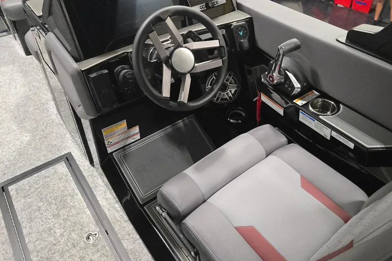 Slide: The Image of 2026 Revel RS25 cockpit with modern steering wheel, control panel, and comfortable seating. - 2