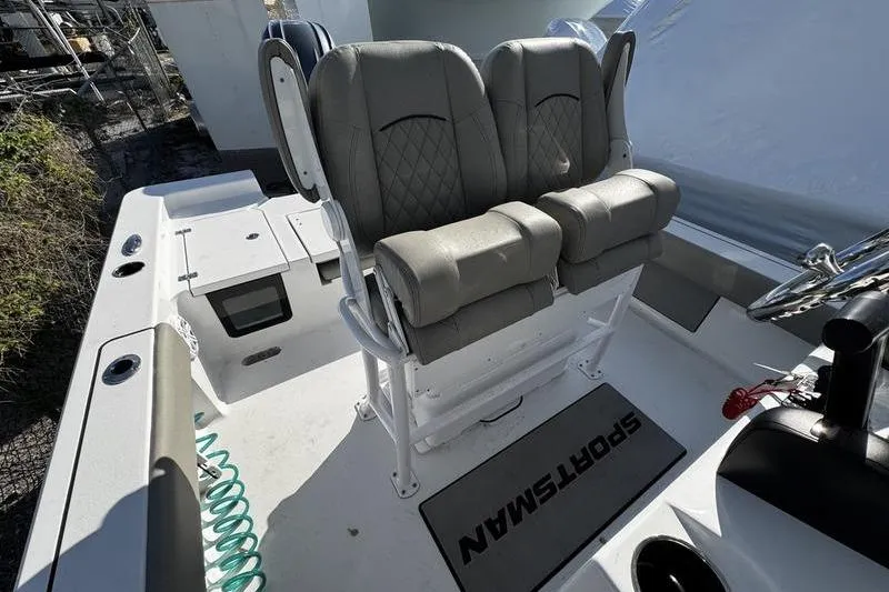 Slide: The Image of 2025 Sportsman Masters 227 Bay Boat seats with diamond stitching, outdoor setting. - 15