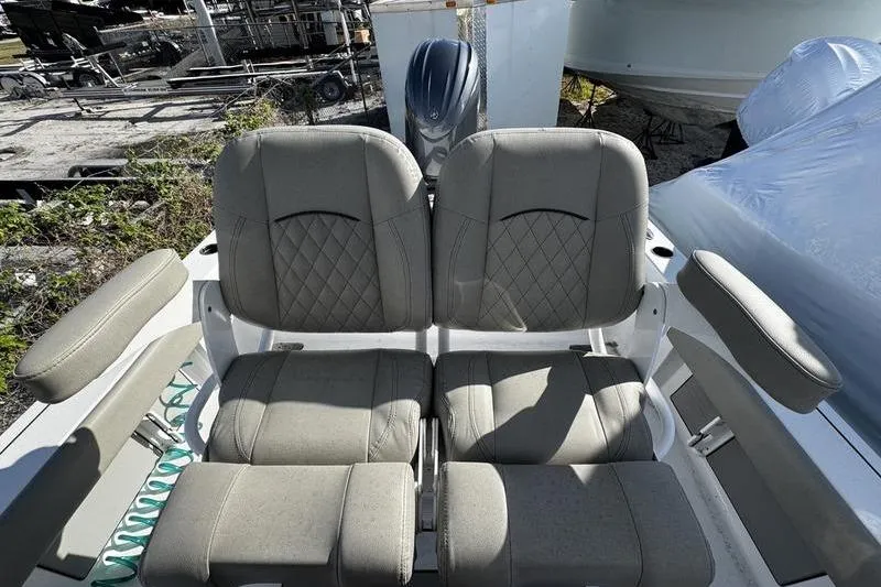 Slide: The Image of 2025 Sportsman Masters 227 Bay Boat dashboard with steering wheel and controls. - 16