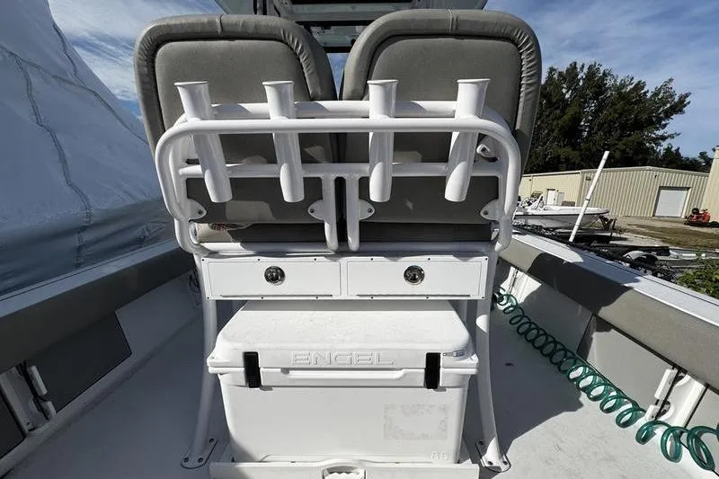 Slide: The Image of 2025 Sportsman Masters 227 Bay Boat with Engel cooler and storage compartments. - 22