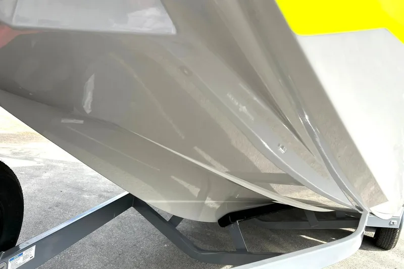 Slide: The Image of 2021 ATX 22 Type-S boat hull on trailer, showcasing sleek design and glossy finish. - 10