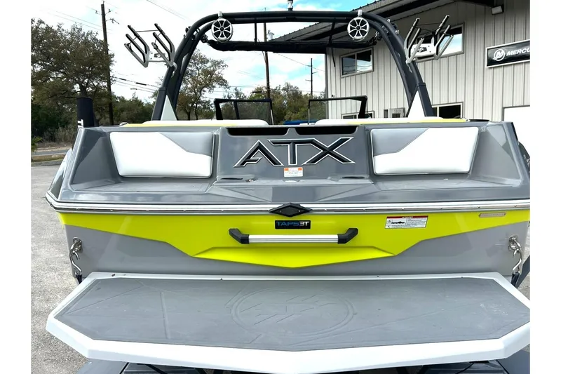 Slide: The Image of 2021 ATX 22 Type-S boat rear view with vibrant yellow and gray design. - 17