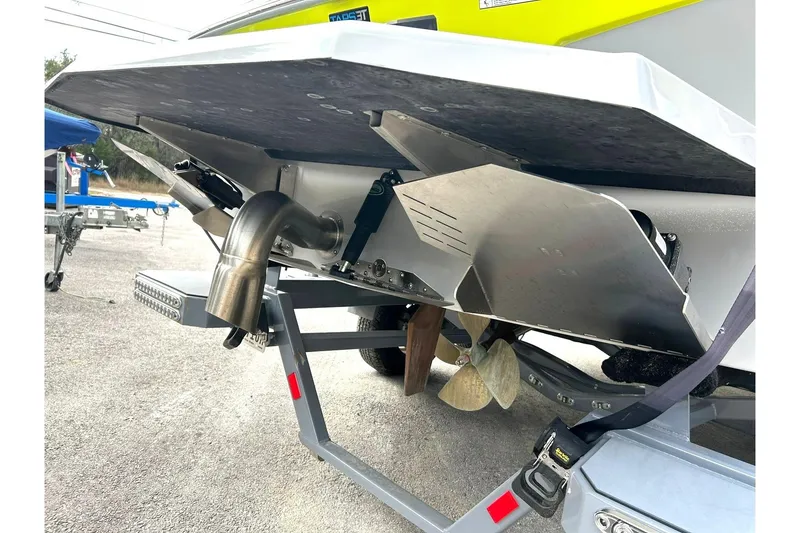Slide: The Image of Rear view of 2021 ATX 22 Type-S boat showing propeller and exhaust system. - 18