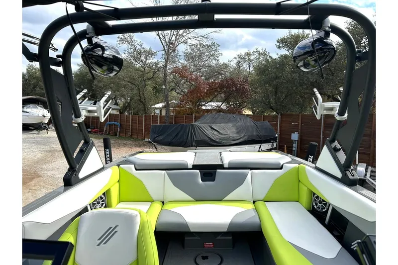 Slide: The Image of 2021 ATX 22 Type-S boat interior with lime green and white seating, outdoor setting. - 31