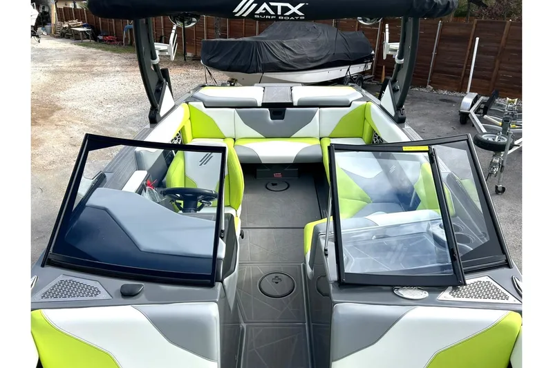 Slide: The Image of 2021 ATX 22 Type-S boat interior with lime green and gray seating. - 32