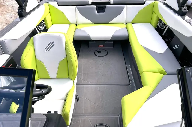 Slide: The Image of Interior of 2021 ATX 22 Type-S boat with lime green and white seating. - 4