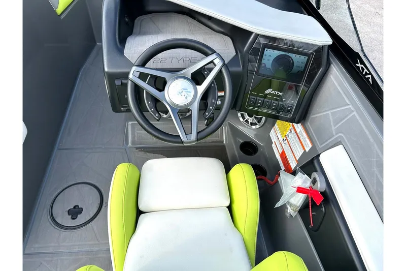 Slide: The Image of Cockpit of 2021 ATX 22 Type-S boat with steering wheel and digital display. - 42