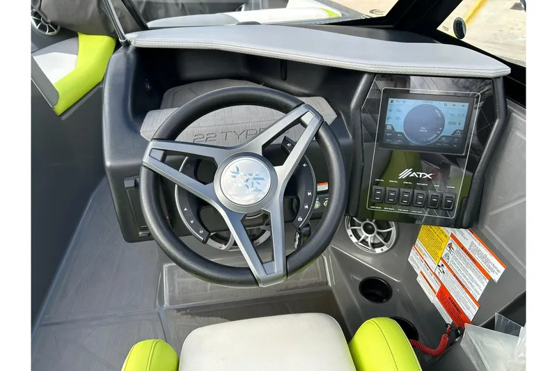 Slide: The Image of Steering wheel and dashboard of 2021 ATX 22 Type-S boat with touchscreen display. - 43