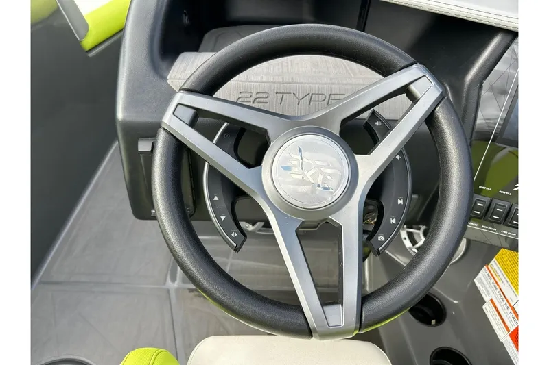 Slide: The Image of Steering wheel of 2021 ATX 22 Type-S boat with control buttons. - 44