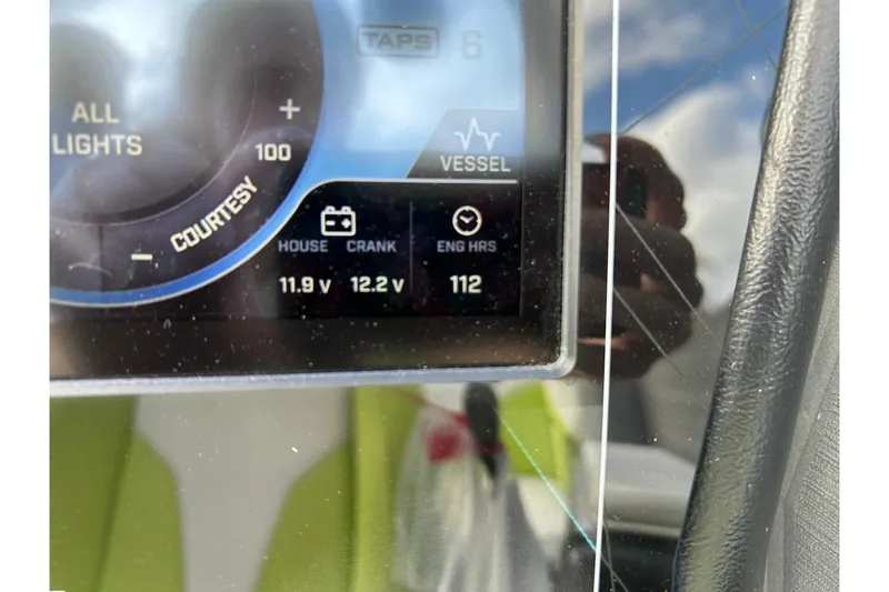 Slide: The Image of ATX 22 Type-S 2021 dashboard display showing voltage and engine hours. - 46