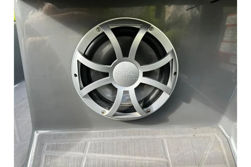 Slide: The Image of ATX 22 Type-S 2021 boat speaker with silver grille in a gray interior. - 54