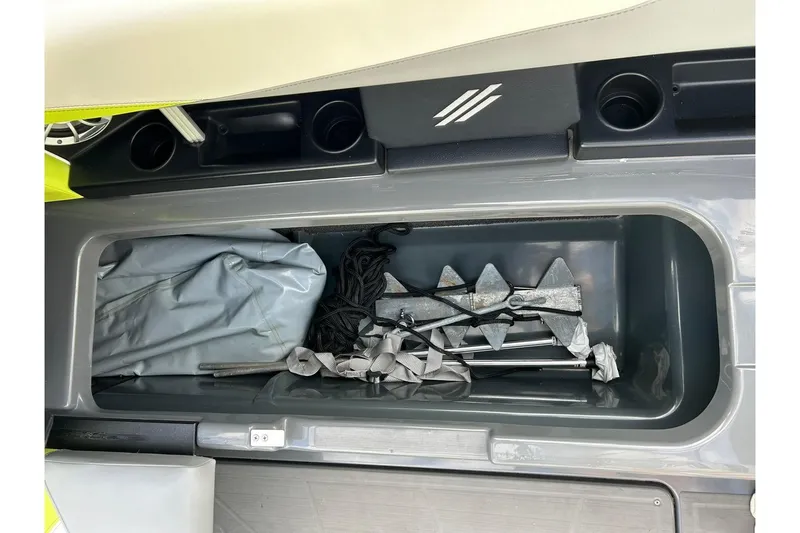 Slide: The Image of Storage compartment in a 2021 ATX 22 Type-S boat with anchor and accessories. - 55
