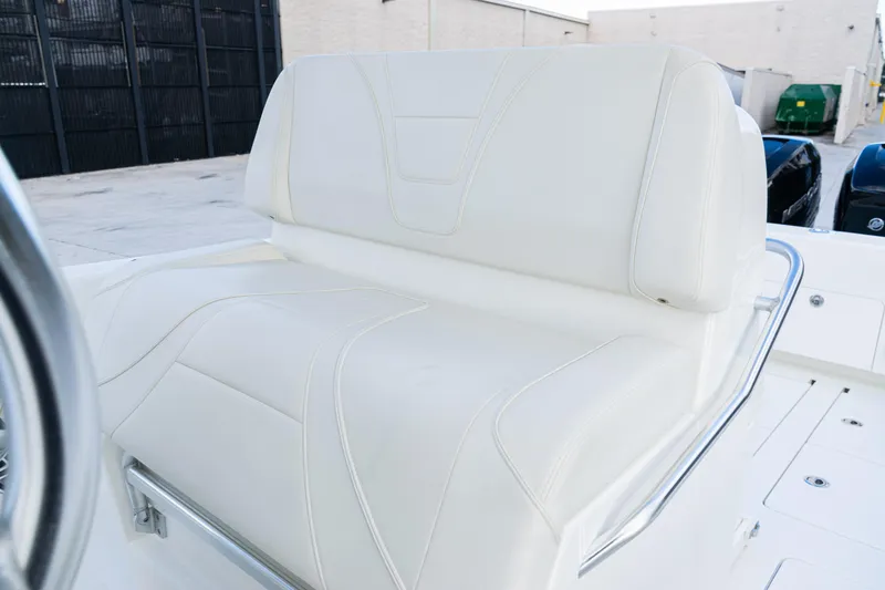 Slide: The Image of 2021 SeaVee 322Z boat with white cushioned seating and sleek design. - 25