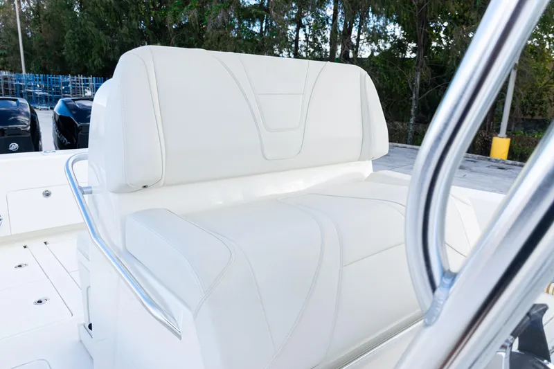 Slide: The Image of 2021 SeaVee 322Z boat with white cushioned seating and stainless steel railing. - 26