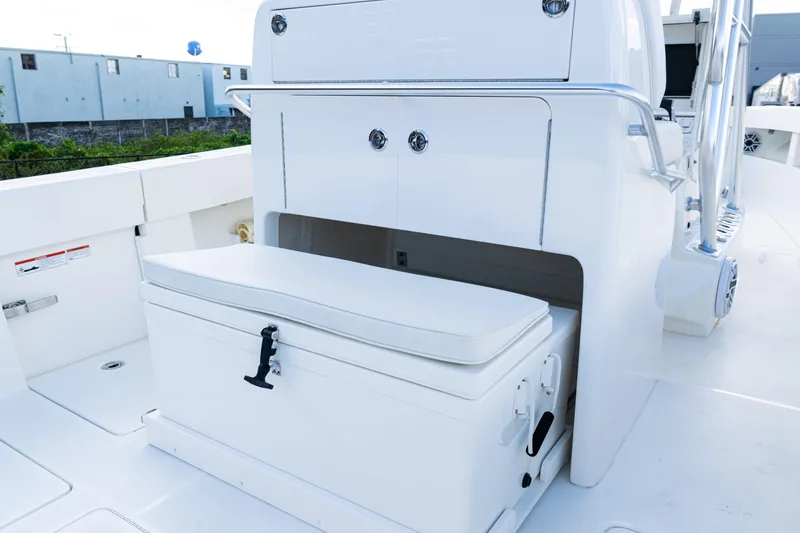 Slide: The Image of 2021 SeaVee 322Z boat interior with storage compartment and cushioned seat. - 30