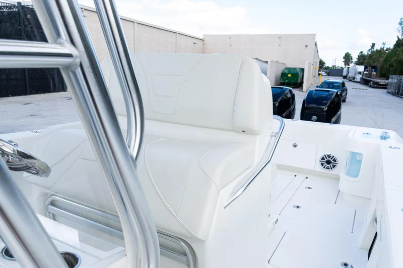 Slide: The Image of 2021 SeaVee 322Z boat interior with white seating and stainless steel details. - 33