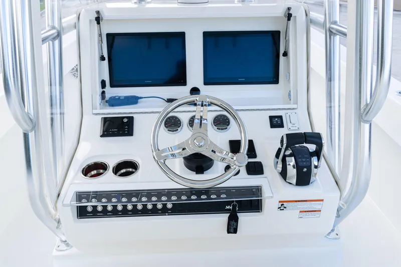 Slide: The Image of 2021 SeaVee 322Z boat console with dual screens and modern controls. - 34