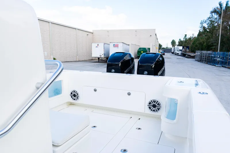 Slide: The Image of 2021 SeaVee 322Z boat with dual outboard engines in a warehouse setting. - 35