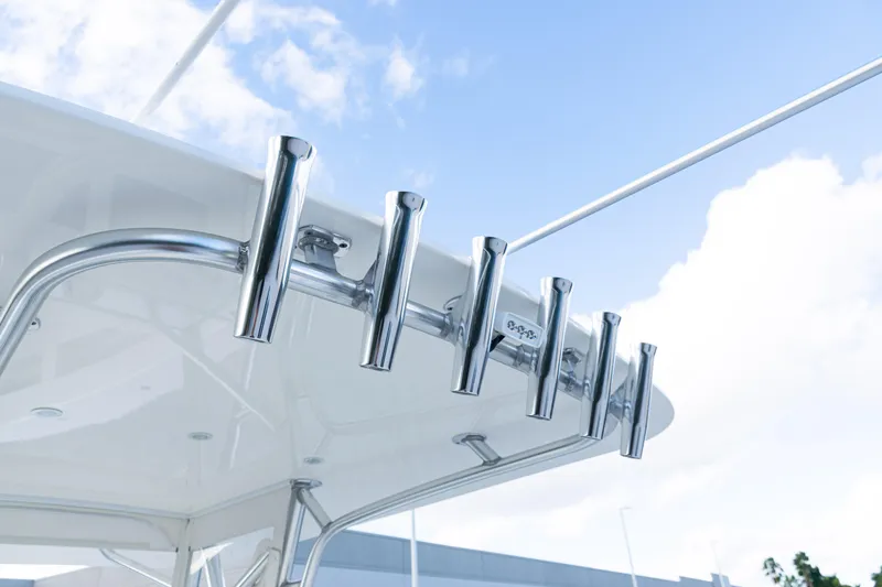 Slide: The Image of 2021 SeaVee 322Z boat with stainless steel rod holders against a blue sky. - 42