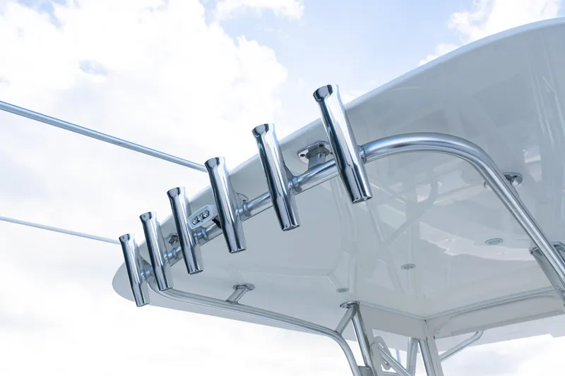 Slide: The Image of 2021 SeaVee 322Z boat with stainless steel rod holders against a cloudy sky. - 44