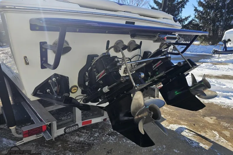 Slide: The Image of 2001 Baja 36 Outlaw boat with dual Mercury outboard motors on a snowy day. - 27