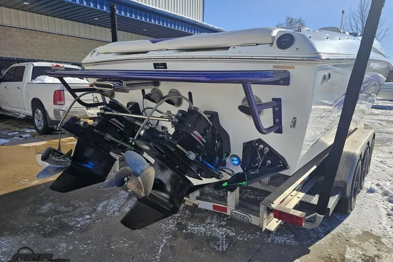Slide: The Image of 2001 Baja 36 Outlaw boat on trailer, showcasing dual Mercury engines. - 30