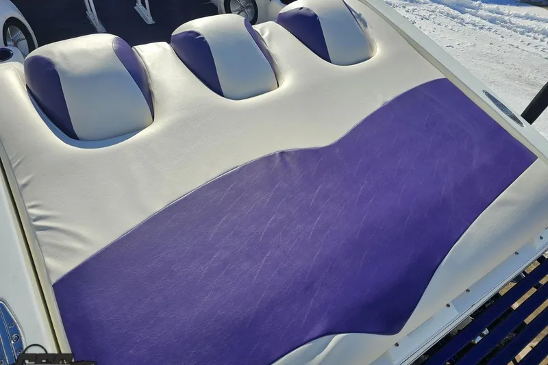 Slide: The Image of 2001 Baja 36 Outlaw boat with purple and white upholstery detail. - 35