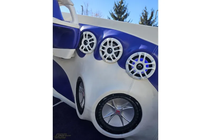 Slide: The Image of 2001 Baja 36 Outlaw boat interior with blue and white speaker system. - 47