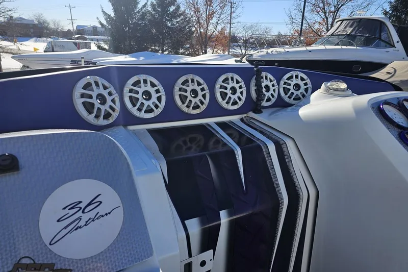 Slide: The Image of 2001 Baja 36 Outlaw boat with custom audio system and sleek design. - 53