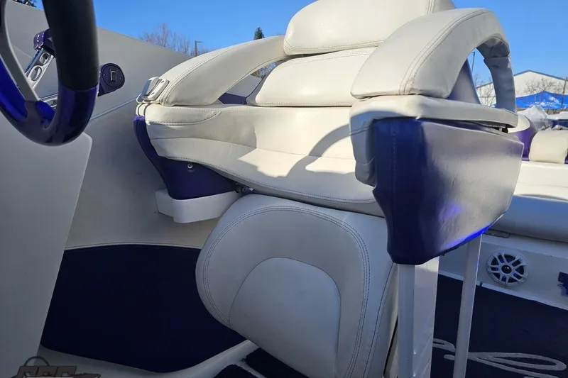 Slide: The Image of 2001 Baja 36 Outlaw boat interior with white and blue seating. - 79