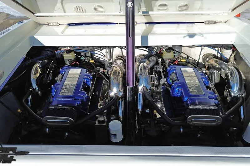 Slide: The Image of 2001 Baja 36 Outlaw engine compartment with dual blue Mercury engines. - 87