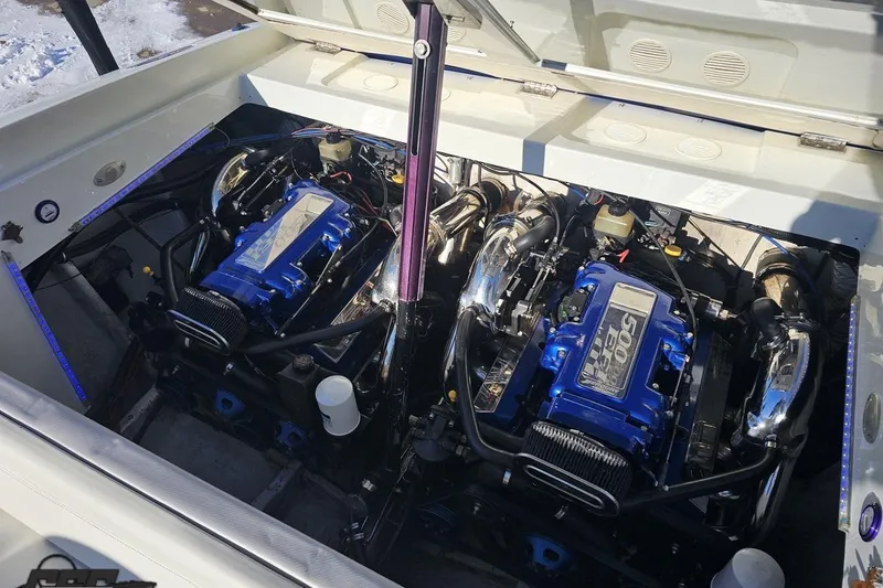 Slide: The Image of 2001 Baja 36 Outlaw boat engine compartment with dual high-performance engines. - 88