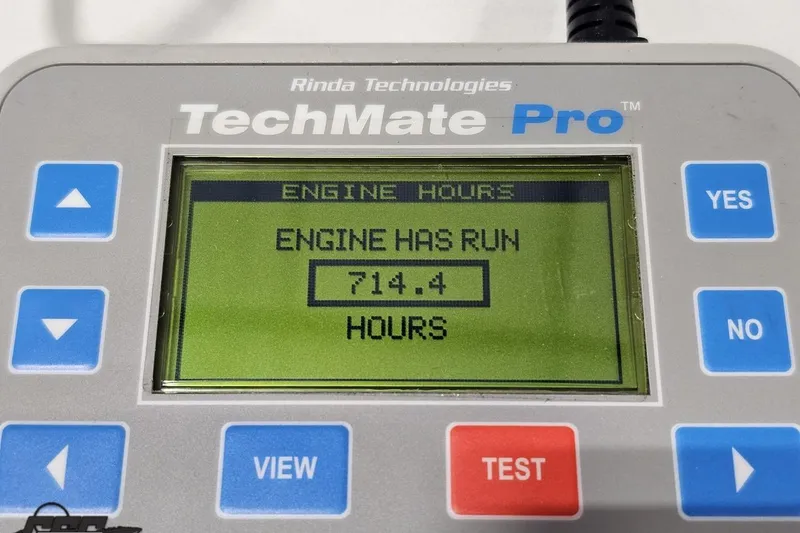 Slide: The Image of TechMate Pro displaying 714.4 engine hours for 2001 Baja 36 Outlaw. - 94