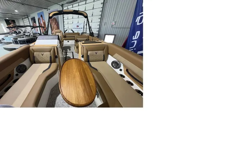 Slide: The Image of Luxurious interior of 2026 Revel RS25 boat with elegant seating and wooden table. - 5