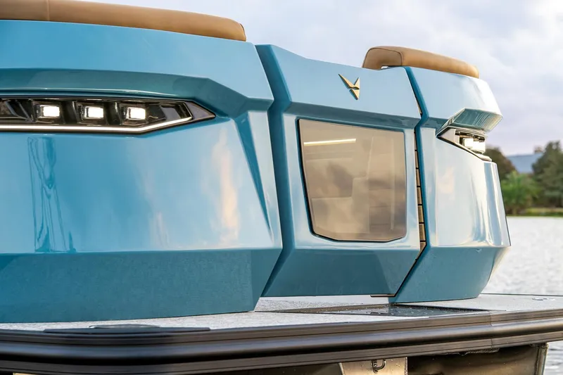 Slide: The Image of Manufacturer Provided Image: Blue Revel RS25 boat rear view with modern design, 2026 model. - 8