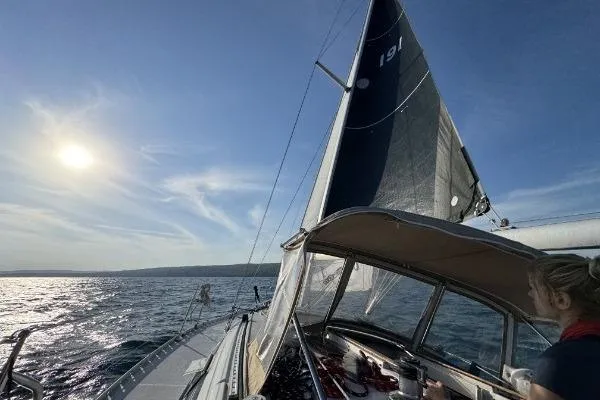 Slide: The Image of Sailing on a 1991 Beneteau Oceanis 370 under a clear blue sky. - 12