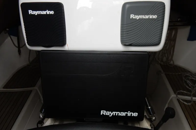 Slide: The Image of Raymarine equipment on a 1991 Beneteau Oceanis 370 sailboat dashboard. - 14