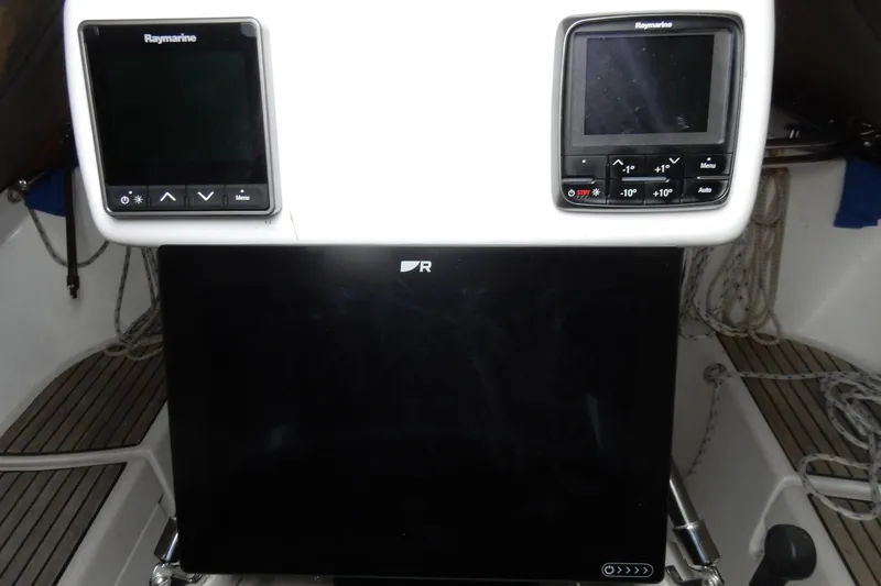 Slide: The Image of Control panel of a 1991 Beneteau Oceanis 370 sailboat with Raymarine displays. - 15