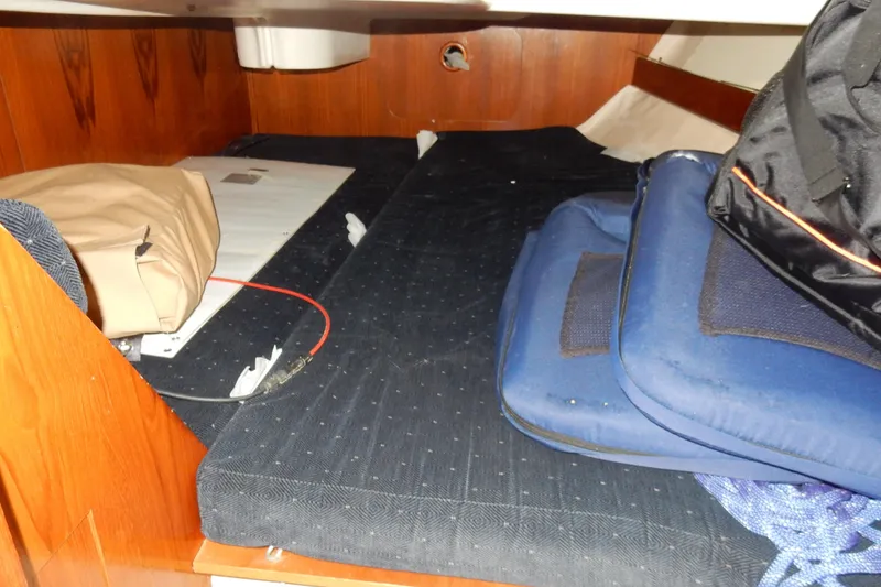 Slide: The Image of Interior cabin of 1991 Beneteau Oceanis 370 sailboat with cushions and storage. - 17