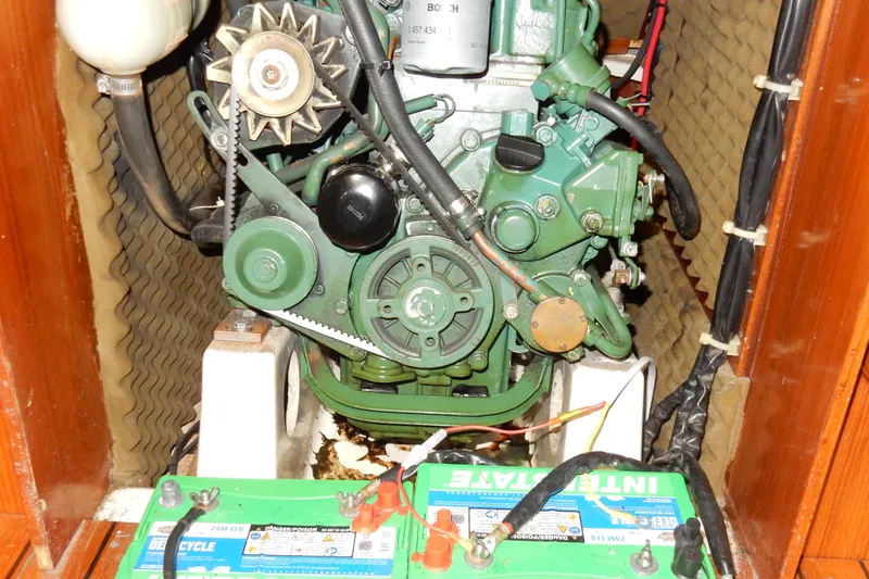 Slide: The Image of Engine compartment of a 1991 Beneteau Oceanis 370 sailboat with visible battery. - 32