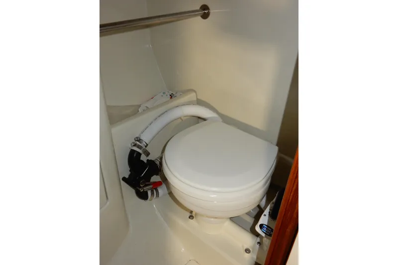 Slide: The Image of Toilet in 1991 Beneteau Oceanis 370 sailboat bathroom, featuring compact marine design. - 35