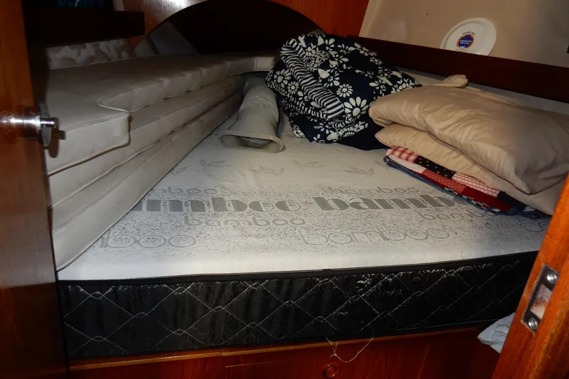 Slide: The Image of Cozy cabin bed with bamboo mattress in 1991 Beneteau Oceanis 370 sailboat. - 38