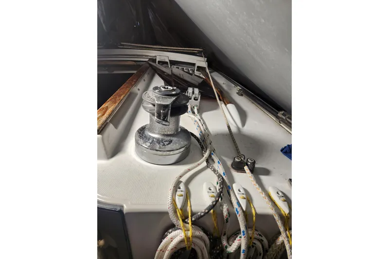 Slide: The Image of Deck of 1991 Beneteau Oceanis 370 sailboat with winch and ropes. - 47