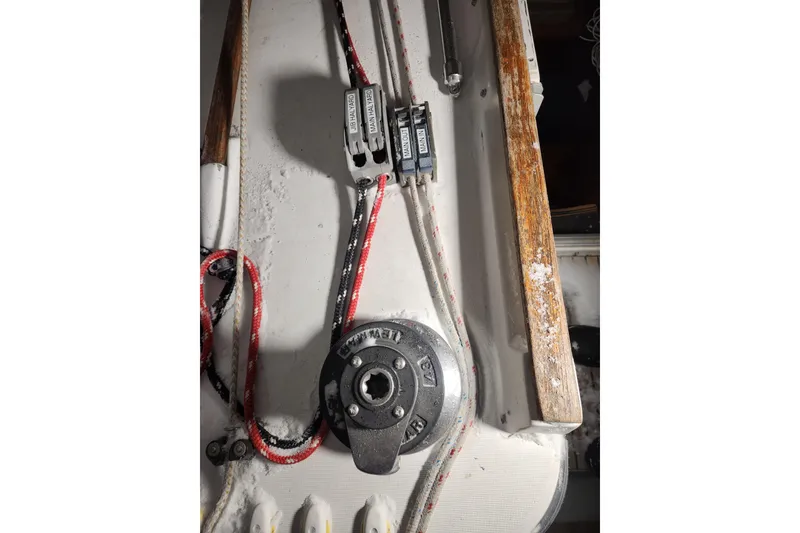 Slide: The Image of Deck equipment of a 1991 Beneteau Oceanis 370 sailboat, featuring winches and ropes. - 49