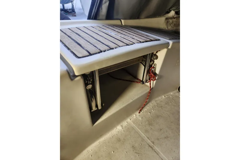 Slide: The Image of Beneteau Oceanis 370, 1991 model, featuring a wooden deck detail and red rope. - 51