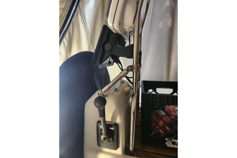 Slide: The Image of 1991 Beneteau Oceanis 370 cockpit with navigation equipment and control lever. - 52